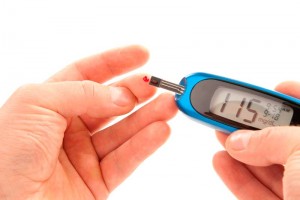 Diabetic patient doing glucose level blood test using ultra mini
