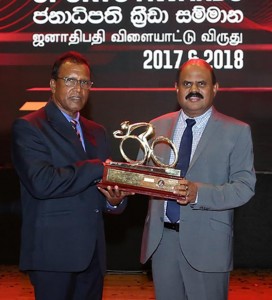 SLT Chairman Mr. P.G.Kumarasinge Sirisena handing over the Trophy to Mr.N. Karunaratne, President/ Cycle Federation of Sri Lanka