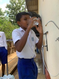 1--A-child-from-Pottuvilluwa-Vidyalaya-drinking-the-safe-and-clean-water-after-the-official-opening-of-the-RO-water-treatment-plant