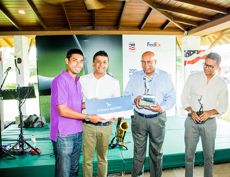 Mr. Arvind Fernando receiving the winning award for the Overall Winner -Gross from Mr. Mohan Pandithage, Chairman, Hayleys Advantis, Mr. Presantha Jayamaha, President, AmCham Sri Lanka and Mr. Karthik Radhakanthan, Head of Sales and Country Lead CMB, Cathay Pacific Airways