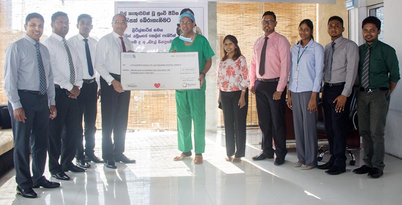 Hayleys Fabric PLC Managing Director Rohan Goonetilleke hand over a donation of Rs. 1.6 million to Consultant Paediatric Cardiologist of the Lady Ridgeway Hospital Dr. Duminda Samarasinghe.