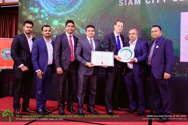 INSEE Cement Sri Lanka team after receiving the award for ‘Excellent Green Commitment Award – Corporate Sector’, Standing from Left to Right, Yasendra Abeygunewardhane, Dishan Shaminda, Rohan Lakmal, Supun Jayasinghe with Jan Kunigk – Executive Vice President Sales, Marketing and Innovation of INSEE Cement Sri Lanka, Eng. Shiromal Fernando - Vice Chairman, Green Building Council of Sri Lanka and Prof. Ranjith Dissanayake - Chairman, Green Building Council of Sri Lanka and Secretary, State Ministry of Urban Development.