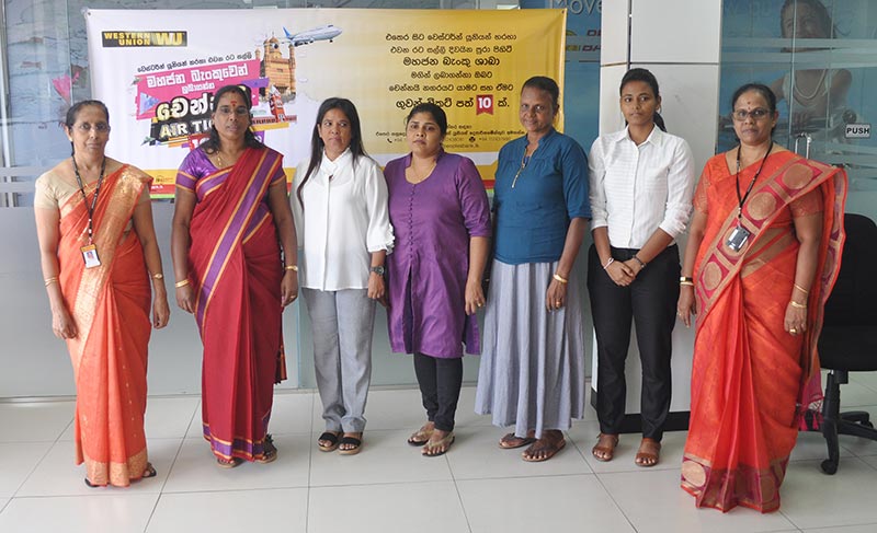 (L to R): Ms. Anoma Mudduwa - Assistant General Manager, Overseas Customer Services, People’s Bank along with a few winners who received their air tickets at the People’s Bank Overseas Customer Services premises and Ms. Renuka Arunasalam -           Chief Manager, People’s Bank.