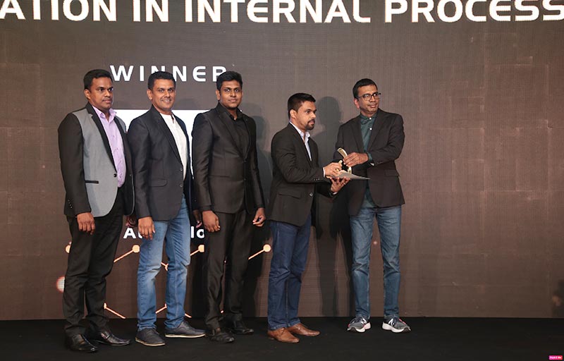 Left to Right: Danura Lunuwilage (Senior Consultant - Robotic Process Automation), Sujeewa Ediriweera (Senior Tech Lead - Software Engineering), Shanmugalingam Kuruparan (Research Engineer - Data Science) and Calvin Hindle (Manager - Emerging Technologies) from MillenniumIT ESP receiving the winning award for Best Innovation in Internal Process category.
