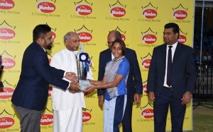 (1)From left: Janmesh Paul Antony, General Manager Marketing of Ceylon Biscuits Limited and Foreign Relations Minister Dinesh Gunawardena presenting the award for Best Female Athlete to Shelinda Jansen from Gateway College Colombo 