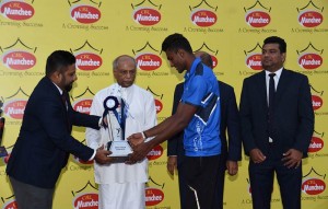 (2)From left: Janmesh Paul Antony, General Manager Marketing of Ceylon Biscuits Limited and Foreign Relations Minister Dinesh Gunawardena presenting the award for Best Male Athlete to Sandun Kumara from Lyceum International School, Wattala