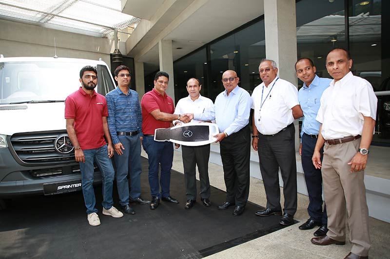 1.Colombo Logistics Group Consultant Major General Chagie P Gallage (Rtd) and  Colombo Port Services (Pvt) Ltd CEO Lasantha Soysa accepting the key from DIMO Chairman & Managing Director Ranjith Pandithage. Also in the picture are DIMO Group CEO Gahanath Pandithage, DIMO Mercedes-Benz Cluster Head Rajeev Pandithage and DIMO Director/CMO Asanga Ranasinghe 