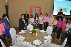 Lakshman Dissanayake of Mount Lavinia Hotel Catering Services (MLHCS) demonstrating table etiquette to the Colombo University undergraduates