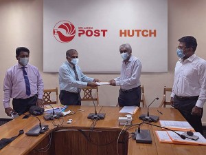 1.From left: Department of Posts Deputy Post Master General (Operations) Rajitha Ranasinghe, Department of Posts Post Master General Ranjith Ariyarathna HUTCH Advisor Finance and Operations Bandhunath de Alwis and HUTCH General Manager Sales Manoj Kumar Moses