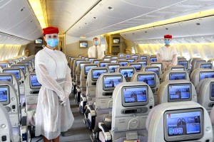 Emirates crew onboard wear a protective disposable gown over their uniforms and a safety visor in addition to masks and gloves.