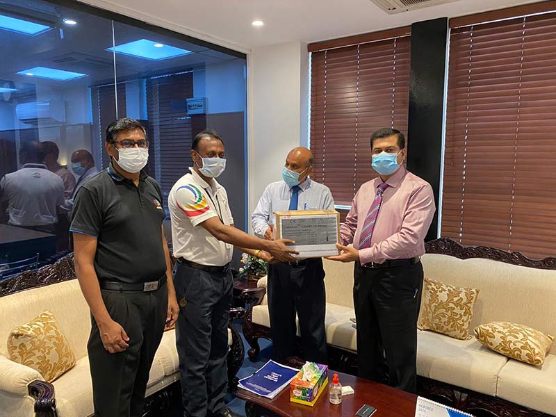 Niranjan Selvadurai, General Manager and S. Balamurugan Deputy Marketing Manager Diagnostics of Sunshine Healthcare’s Medical Devices team handing over the PCR test kits to Kanchana Jayarathna, Private Secretary to the Minister of Health and Dr. Sunil De Alwis, Additional Secretary at the Ministry of Health.  