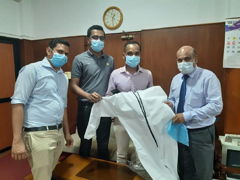 MAS hands over 4650 units of non-woven disposable coverall PPE to the additional secretary to the Ministry of Health, Dr. Sunil de AlwisL-R: Dr. Mahen Boralessa, Mafaz Mohideen – MAS, Anoshan Wickramaratne – MAS, Dr. Sunil de Alwis