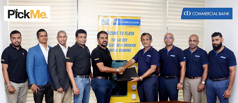 Commercial Bank’s Head of Digital Banking Mr Pradeep Banduwansa (fourth from right) and PickMe Chief Operating Officer Mr Isira Perera exchange the agreement in the presence of Messrs Sanjiv Alles and Mufaddal Lukmanjee, Directors of Digital Payment Systems Pvt Ltd. (second and third from left), Mr Shifaz Riyaz, Chief Financial Officer of PickMe (fourth from left) and other representatives of PickMe and Commercial Bank’s Digital Banking Unit.