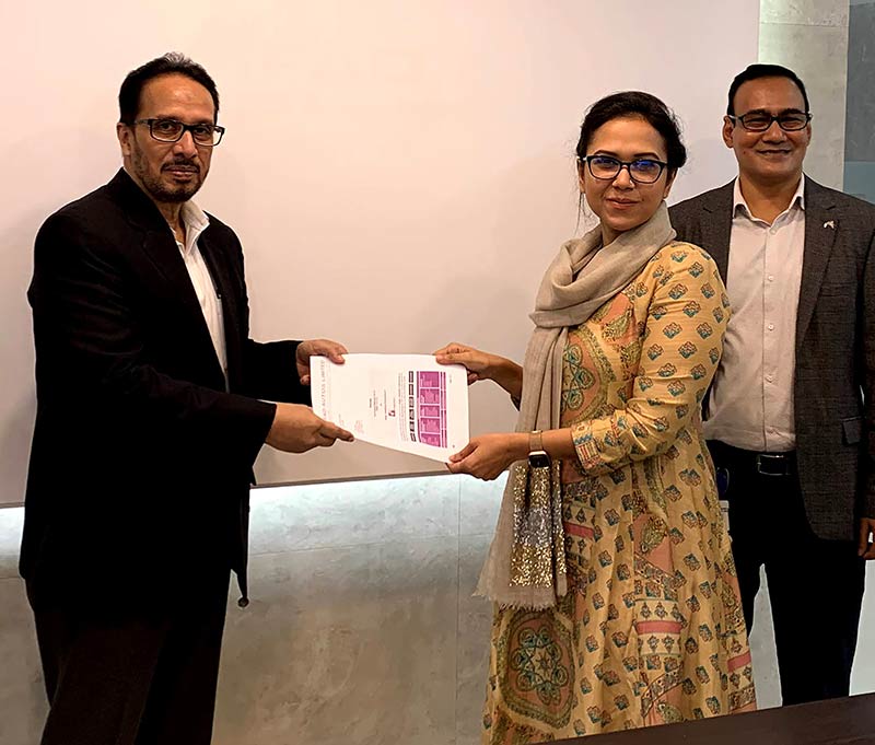 From Left:  Zahid Khan, CEO VS ONE Bangladesh signs agreement with Ms. Shejuti Ahmed, Director IFAD Autos Limited and Mr. Mohammed Al-Amin, CFO IFAD Autos Limited