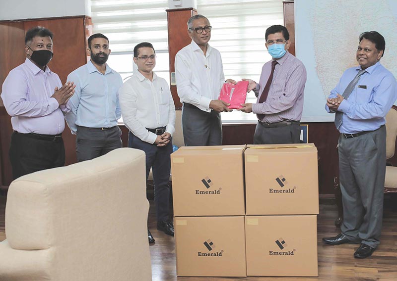 Emerald donates PPE to COVID 19 frontline medical staff. Mr. M.M.M Ihsan, Executive Director, Emerald International introduces Emerald NMRA approved reusable 5-ply face masks to Dr. Anil Jasinghe, Director-General of Health Services in Sri Lanka.