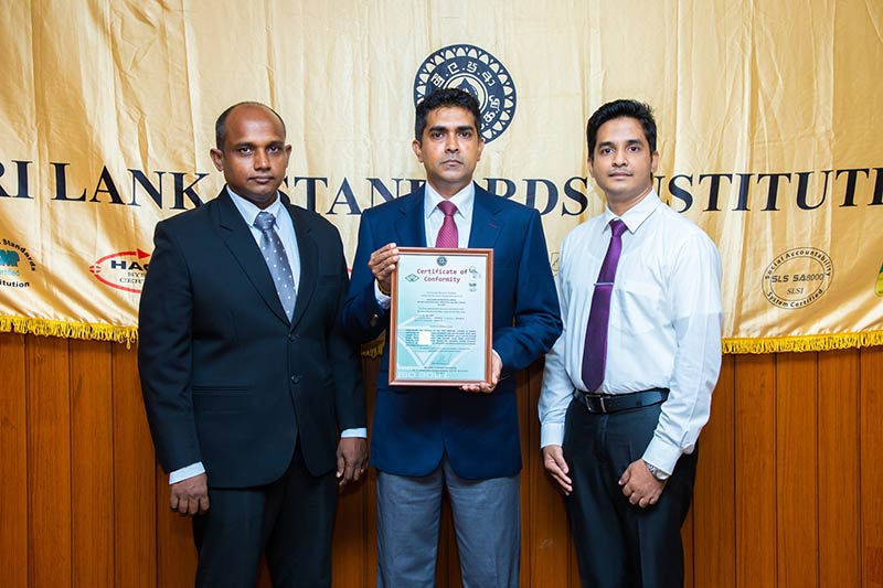 1.(L-R) Assistant GM Mr. Asanga Rathnayake, Director/GM Mr. T K Senevirathne, and Assistant Brand Manager Mr. Amal Iddamalgoda accepting the ISO certificate from SLSI