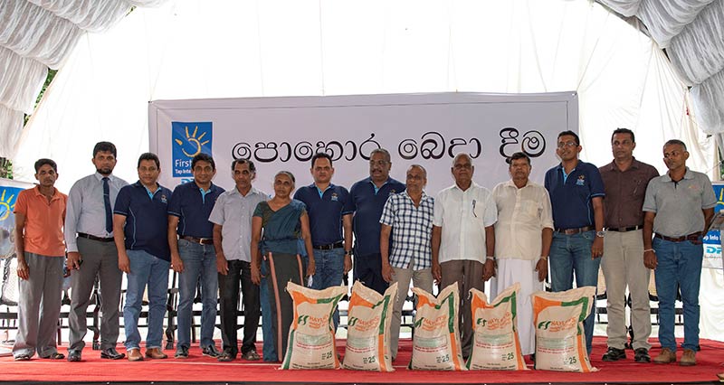 DPL Top management and officials from Rubber Research Institute with rubber farmers who received fertilizer under the DPL Firstlight initiative