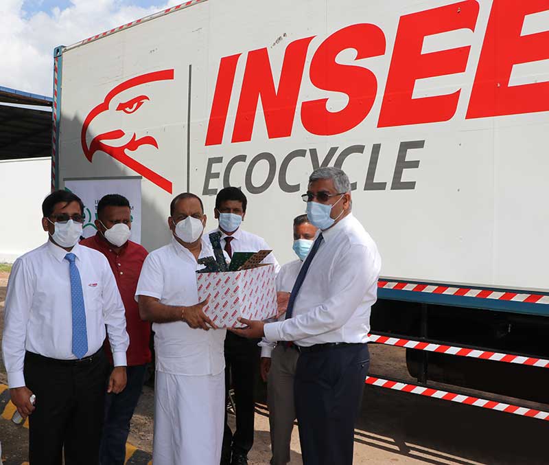 Nandana Ekanayake (right), Chairman, INSEE Cement and Hon. Mahinda Amaraweera, (center) Minister of Environment, marking the first consignment of processed electronic waste to be exported to Ousei Kankyo Japan.