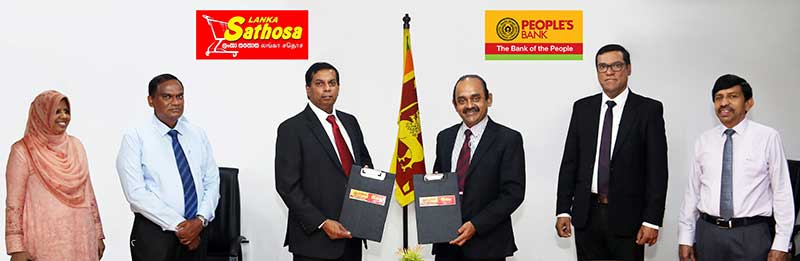 (From L to R) Lanka Sathosa Actng Senior Accountant Ms. Aisha Nawfel, Deputy General Manager-Finance, Lanka Sathosa Mr. Susiri Perera, Chairman-Lanka Sathosa, Dr.Nushad Perera, Chairman-Peoples Bank, Mr. Sujeewa Rajapakse, People's Bank CEO/GM Mr. Ranjith Kodituwakku, People’s Bank, Senior Deputy General Manager-Retail Banking Mr. K.B.Rajapakse  