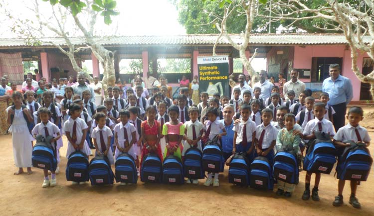 Photo-Caption—McLarens-Lubricants-team-with-the-children-of-Perakum-Vidyalaya-Galkulama,-Anuradhapura