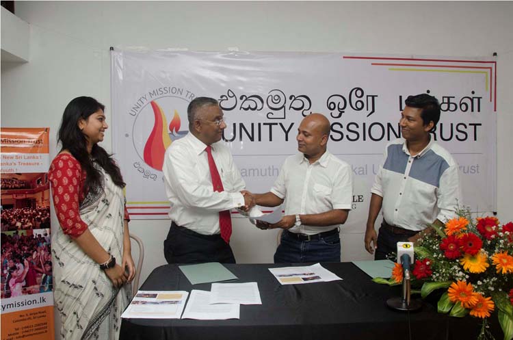 Bertal Pinto- Jayawardena, Founder Trustee and Co-ordinator of UMT signing De Lanerolle Brothers to join the Ekamuthu Oray Makkal Unity Mission Trust (UMT) as Brand Ambassadors