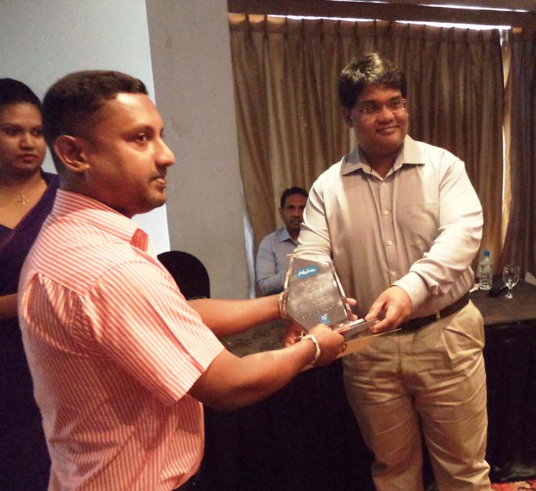 1. Priyanjith Weerasooria, Managing Director of Alpha (Right) awarding the “Best Performing Dealer” Prompt Furniture -Badulla