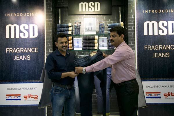 2_Officially-handing-over-the-first-Fragrance-jean-to-Mr.-Rifandeen-–-Purchasing-&-Operations-Manager,-NOLIMIT