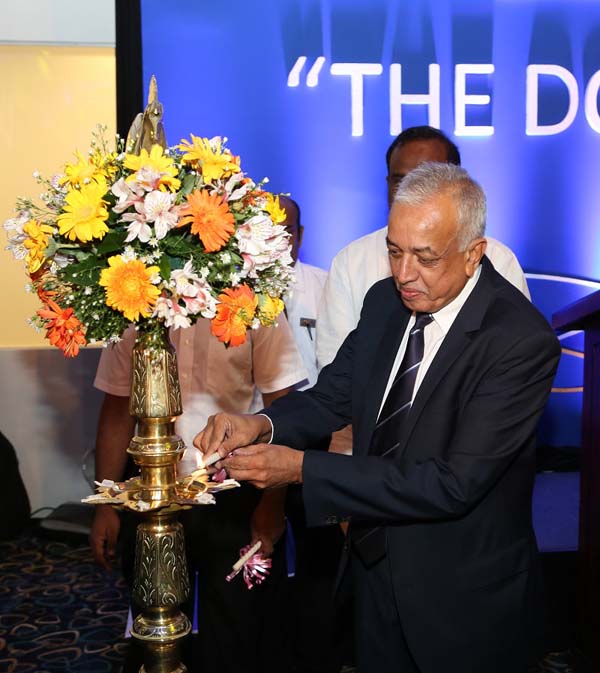 Chief Guest Minister of Development Strategies and International Trade Malik Samarawickreme lights the oil lamp inaugurating The Dome at Global Towers
