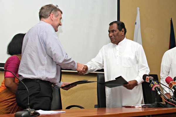 Philippe Richart, CEO, Holcim (Lanka) Limited shakes hands with Hon. John Senawirathne, Minister of Labour, Ministry of Labour