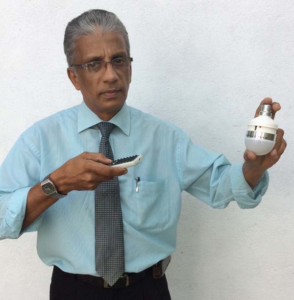 PHOTO – Technical Engineer Shiranka De Silva with his innovation, the Smart Switch LED light bulb