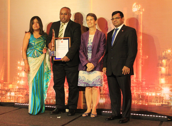 DIMO CEO Gahanath Pandithage accepting the overall runners-up award