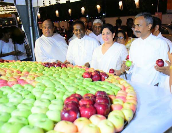 Deputy Speaker of Sri Lanka parliament Thilanga Sumathipala joining the apple distribution