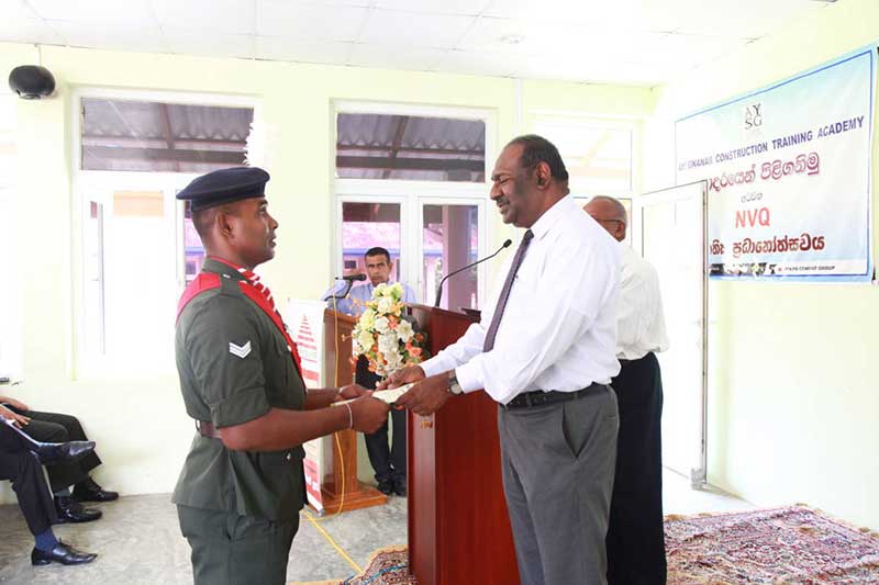 Chief-Guest-Gen.-Udayantha-Wijerathna-awarding-the-NVQ-Certificate-to-a-recipient
