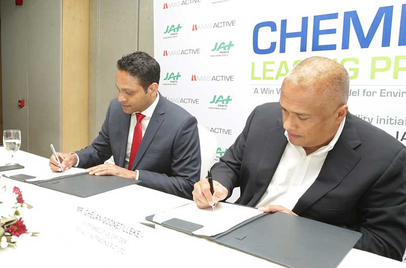 Photo-02—Managing-Director-of-JAT-Holdings-Aelian-Gunawardene-(in-red-tie)-with-MAS-Active-CEO-Chelan-Goonetilleke