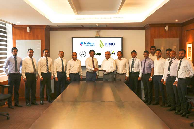 DIMO-and-NTB-officials-exchanging-the-agreements