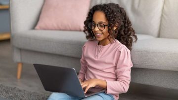 E-learning,Concept.,African,American,Gen,Z,Girl,Using,Her,Laptop,