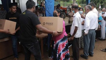 Binance-Angel-Ishara-handing-out-food-packs-from-Binance-Charity-to-the-local-residents